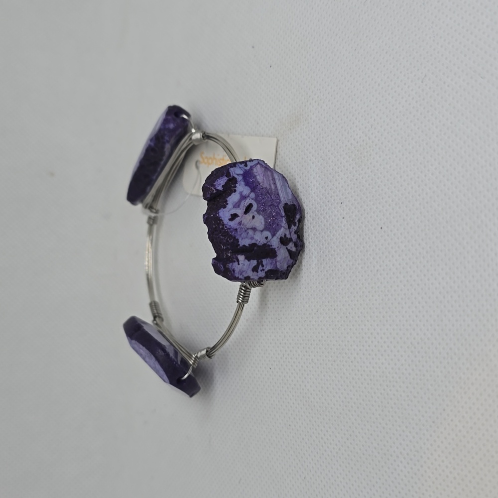 Silver wire bracelet with purple stones